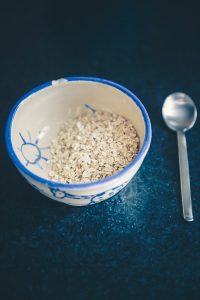 cereals in blue and white ceramic bowl